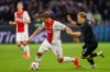 FILE - Ajax's Mika Godts, left, duels for the ball with Besiktas' Jonas Svensson during the Europa League soccer match between Ajax and Besiktas, at the Johan Cruyff ArenA, in Amsterdam, Netherlands, on Sept. 26, 2024. (AP Photo/Maurice van Steen, File)