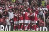 Arsenal's Riccardo Calafiori celebrates with teammates after scoring the opening goal during the FA Community Shield final soccer match between Arsenal and Manchester City in Cardiff, Wales, Sunday, Aug.16, 2026. (AP Photo/Alastair Grant)