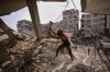 Palestinians remove iron from the rubble of buildings destroyed by Israeli airstrikes during the war with Hamas, repair and recycle it for construction, building tents or selling it, in Gaza City, Sunday, Aug. 16, 2026. (AP Photo/Jehad Alshrafi)