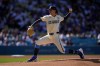 Los Angeles Dodgers starting pitcher Justin Wrobleski throws to the plate during the first inning of a baseball game against the Milwaukee Brewers, Saturday, Aug. 15, 2026, in Los Angeles. (AP Photo/Mark J. Terrill)