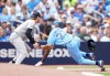 New York Yankees third baseman Ryan McMahon (19) tags out Toronto Blue Jays outfielder Daz Cameron (23) at third base during fifth inning American League MLB baseball action in Toronto on Sunday, Aug. 16, 2026. THE CANADIAN PRESS/Nathan Denette