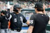 Chicago White Sox's Munetaka Murakami (5) celebrates with Davis Martin (65) after hitting a two-run home run against the Detroit Tigers during the seventh inning of a baseball game Sunday, Aug. 16, 2026, in Detroit. (AP Photo/Duane Burleson)