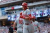 Philadelphia Phillies' Alec Bohm, center, celebrates after hitting a three-run home run during the sixth inning of a baseball game against the Minnesota Twins, Sunday, Aug. 16, 2026, in Minneapolis. (AP Photo/Bailey Hillesheim)