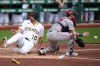 Pittsburgh Pirates' Bryan Reynolds (10) scores ahead of a throw to Boston Red Sox catcher Connor Wong, right, on a single by Brandon Lowe off Red Sox pitcher Patrick Sandoval during the first inning of a baseball game in Pittsburgh, Sunday, Aug. 16, 2026. (AP Photo/Gene J. Puskar)
