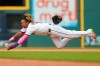 Cleveland Guardians' Jose Ramirez dives but is caught while trying to steal second base during the first inning of a baseball game against the San Diego Padres in Cleveland, Sunday, Aug. 16, 2026. (AP Photo/Tim Phillis)