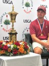 Jack Whaley admires his US Amateur golf championship trophy Sunday, Aug. 16, 2026, at Merion Golf Club in Ardmore, Pa. (AP Photo/Dan Gelston)