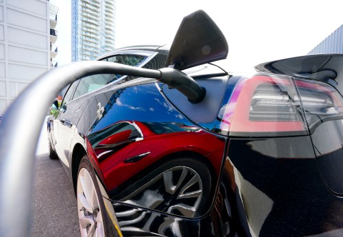 An electric vehicle is charged in Ottawa on Wednesday, July 13, 2022. THE CANADIAN PRESS/Sean Kilpatrick