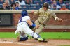 New York Mets' Francisco Alvarez, left, tags out San Diego Padres' Manny Machado during the first inning of a baseball game Monday, Aug. 17, 2026, in New York. (AP Photo/Frank Franklin II)