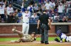 New York Mets pitcher Nolan McLean reacts after catcher Francisco Alvarez, right, tagged out San Diego Padres' Manny MacHado during the first inning of a baseball game Monday, Aug. 17, 2026, in New York. (AP Photo/Frank Franklin II)