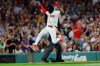 Boston Red Sox's Ceddanne Rafaela leaps over equipment after scoring during the sixth inning of a baseball game against the Arizona Diamondbacks Monday, Aug. 17, 2026, in Boston. (AP Photo/CJ Gunther)