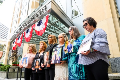Parents hold pictures of their deceased children during a protest against social media platforms outside the Ronald V. Dellums Federal Building and U.S. Courthouse on Tuesday, Aug. 18, 2026, in Oakland, Calif. (AP Photo/Noah Berger)