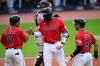 Cleveland Guardians' Jo Adell is congratulated by Jose Ramirez (11) and Steven Kwan (38) after hitting a three-run home run off San Francisco Giants starting pitcher Carson Whisenhunt during the first inning of a baseball game, Tuesday, Aug. 18, 2026, in Cleveland. (AP Photo/David Dermer)