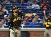 San Diego Padres' Fernando Tatis Jr. follows through on a two run home run against the New York Mets during the fifth inning of a baseball game, Tuesday, Aug. 18, 2026, in New York. (AP Photo/Noah K. Murray)