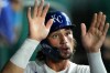 Kansas City Royals' Jac Caglianone celebrates in the dugout after scoring on a double hit by Vinnie Pasquantino during the seventh inning of a baseball game against the Athletics, Tuesday, Aug. 18, 2026, in Kansas City, Mo. (AP Photo/Charlie Riedel)