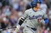 Los Angeles Dodgers' Shohei Ohtani drops his bat as he heads up the first-base line after hitting a two-run home run off Colorado Rockies starting pitcher Ryan Feltner in the third inning of a baseball game Tuesday, Aug. 18, 2026, in Denver. (AP Photo/David Zalubowski)