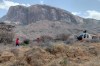 This photo provided by Kenya Red Cross shows Kenya Red Cross emergency response teams during a multi-agency rescue and recovery operation in response to a helicopter crash that killed tourists near Mt. Ololokwe in Samburu, Kenya, Wednesday, Aug. 19, 2026. (Kenya Red Cross via AP)