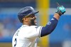 Tampa Bay Rays' Yandy Díaz celebrates his two-run home run off Toronto Blue Jays pitcher Max Scherzer during the first inning of a baseball game Wednesday, Aug. 19, 2026, in St. Petersburg, Fla. (AP Photo/Chris O'Meara)