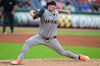 San Francisco Giants starting pitcher Matt Wilkinson delivers during the first inning of a baseball game against the Cleveland Guardians, Wednesday, Aug. 19, 2026, in Cleveland. (AP Photo/David Dermer)
