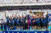 FILE - Inter Milan players celebrate with the Italian Serie A soccer championship trophy at the end of their final-round match against Hellas Verona in Milan, Italy, Sunday, May 17, 2026. (AP Photo/Luca Bruno, File)