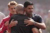 Arsenal's manager Mikel Arteta, right, hugs with Manchester City's head coach Enzo Maresca prior to the FA Community Shield final soccer match between Arsenal and Manchester City in Cardiff, Wales, Sunday, Aug.16, 2026. (AP Photo/Alastair Grant)