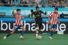 Manchester City's Savinho, center, battles for the ball with Atletico Madrid's Dani Martinez, left, and Obed Vargas during the preseason friendly soccer match between Manchester City and Atletico Madrid in Seoul, South Korea, Sunday, Aug. 9, 2026. (AP Photo/Lee Jin-man)