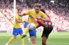 Sheffield United's Sam McCallum, right, and Birmingham City's Phil Neumann in action during the Championship soccer match between Sheffield United and Birmingham City in Sheffield, England, Saturday Aug. 15, 2026. (Gary Oakley/PA via AP)