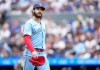 Toronto Blue Jays pitcher Dylan Cease walks back to the dugout while playing against the New York Yankees during second inning American League MLB baseball action in Toronto on Sunday, Aug. 16, 2026. THE CANADIAN PRESS/Nathan Denette
