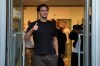 Inter's newly acquired player from Liverpool, Curtis Jones, gives the thumb up sign as he leaves the Italian Olympic Commitee headquarters for competitive sports medical examinations, in Milan, Italy, Friday, Aug. 21, 2026. (Claudio Furlan/LaPresse via AP)
