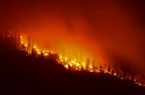 The Quilpituk Creek wildfire burns on the west side of Okanagan Lake near Fintry, B.C., late Monday, Aug. 3, 2026. THE CANADIAN PRESS/Darryl Dyck
