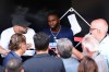 New York Mets' Luis Robert Jr., center, speaks to media before a baseball game against the Chicago White Sox in Chicago, Friday, Aug. 21, 2026. (AP Photo/Jessie Alcheh)