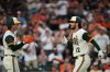 Baltimore Orioles' Dylan Beavers (12) celebrates with Coby Mayo, left, after hitting a home run during the second inning of a baseball game against the Tampa Bay Rays, Friday, Aug. 21, 2026, in Baltimore. (AP Photo/Stephanie Scarbrough)