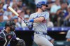 Los Angeles Dodgers' Kyle Tucker singles off Colorado Rockies starting pitcher Kyle Freeland in the second inning of a baseball game Wednesday, Aug. 19, 2026, in Denver. (AP Photo/David Zalubowski)