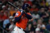Houston Astros' Yordan Alvarez watches his RBI double during the fifth inning of a baseball game against the Athletics, Friday, Aug. 21, 2026, in Houston. (AP Photo/Kevin M. Cox)