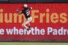 San Diego Padres right fielder Fernando Tatis Jr. leaps off the wall as he is unable to catch a hit for a two-RBI triple by Minnesota Twins' Kody Clemens during the fourth inning of a baseball game Friday, Aug. 21, 2026, in San Diego. (AP Photo/Gregory Bull)