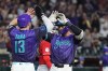 Arizona Diamondbacks' Jordan Lawlar, right, celebrates his two-run home run against the Cincinnati Reds with Diamondbacks' Tim Tawa (13) during the second inning of a baseball game, Friday, Aug. 21, 2026, in Phoenix. (AP Photo/Ross D. Franklin)