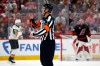 FILE - Referee Garrett Rank (7) makes a call during the second period in Game 2 of the NHL hockey Stanley Cup Final series between the Carolina Hurricanes and the Vegas Golden Knights in Raleigh, N.C., June 4, 2026. (AP Photo/Karl DeBlaker, File)