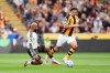 Manchester United's Bryan Mbeumo, left, and Hull City's Matt Crooks in action during the English Premier League soccer match between Hull City and Manchester United in Kingston upon Hull, England, Saturday Aug. 22, 2026. (Annabel Lee-Ellis/PA via AP)