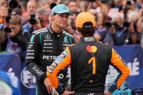 Mercedes driver George Russell of Britain, left, atlks to McLaren driver Lando Norris of Britain after the qualifying for the Formula One Dutch Grand Prix in Zandvoort , Netherlands, Saturday, Aug. 22, 2026. (AP Photo/Darko Bandic)