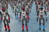Robots are prepared ahead the opening ceremony of the World Humanoid Robot Games in Beijing, Saturday, Aug. 22, 2026. (AP Photo/Achmad Ibrahim)