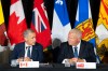 Prime Minister Mark Carney, left, speaks with Ontario Premier Doug Ford during the closing press conference at the First Ministers Meetings in Charlottetown on Thursday, July 23, 2026. THE CANADIAN PRESS/Darren Calabrese