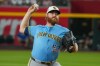 FILE - Milwaukee Brewers pitcher Brandon Woodruff works against the Arizona Diamondbacks during the first inning of an baseball game, July 4, 2026, in Phoenix. (AP Photo/Darryl Webb, File)
