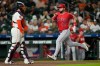 Los Angeles Angels' Nolan Schanuel (18) scores as Houston Astros catcher Yainer Diaz stands in front of home plate during the fifth inning of a baseball game Tuesday, Aug. 18, 2026, in Houston. (AP Photo/David J. Phillip)