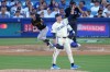 Los Angeles Dodgers starting pitcher Tarik Skubal, right, gestures as Pittsburgh Pirates' Henry Davis flies out during the seventh inning of a baseball game Saturday, Aug. 22, 2026, in Los Angeles. (AP Photo/Mark J. Terrill)
