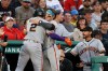 San Francisco Giants' Willy Adames (2) is congratulated at the dugout by teammate Drew Gilbert after hitting a home run off Boston Red Sox starting pitcher Patrick Sandoval during the first inning of a baseball game Saturday, Aug. 22, 2026, in Boston. (AP Photo/Mary Schwalm)