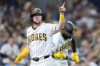 Jake Cronenworth celebrates after scoring off a single by Jackson Merrill in the sixth inning of a baseball game against the Minessota Twins Saturday, Aug. 22, 2026, in San Diego, Calif. (AP Photo/Karl Anderson)