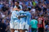 Manchester City's Josko Gvardiol (24) celebrates with teammates after scoring his side's second goal during the English Premier League soccer match between Manchester City and Bournemouth in Manchester, England, Sunday, Aug. 23, 2026. (AP Photo/Dave Thompson)