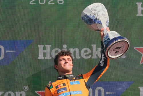 McLaren driver Lando Norris of Britain holds the trophy after winning the Formula One Dutch Grand Prix in Zandvoort , Netherlands, Sunday, Aug. 23, 2026. (AP Photo/Patrick Post)