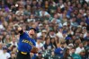Seattle Mariners' Brendan Donovan throws to first base on a single from Chicago Cubs' Alex Bregman, making a throwing error and allowing Cubs' Seiya Suzuki to reach third base during the third inning of a baseball game, Friday, Aug. 21, 2026, in Seattle. (AP Photo/Lindsey Wasson)