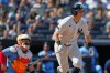 Toronto Blue Jays catcher Alejandro Kirk, left, watches as New York Yankees' Ben Rice follows through on a two-run single during the sixth inning of a baseball game Sunday, Aug. 23, 2026, in New York. (AP Photo/Frank Franklin II)