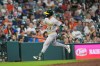 Athletics' Max Muncy celebrates after hitting a home run against the Houston Astros during the seventh inning of a baseball game Sunday, Aug. 23, 2026, in Houston. (AP Photo/David J. Phillip)